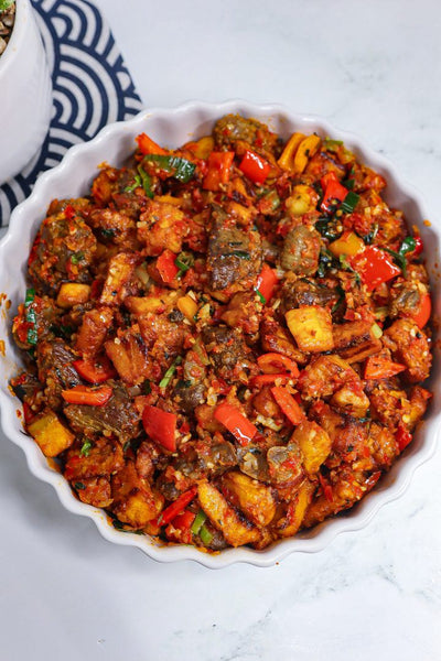 GIZDODO (gizzards and plantain “dodo”)  (IN TRAY)